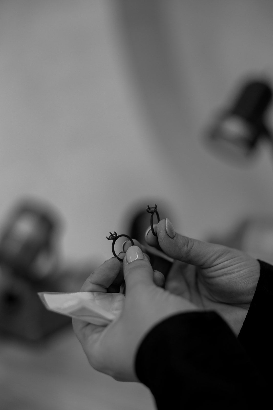 Holding Two Rings Black